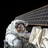 Astronaut and solar panels